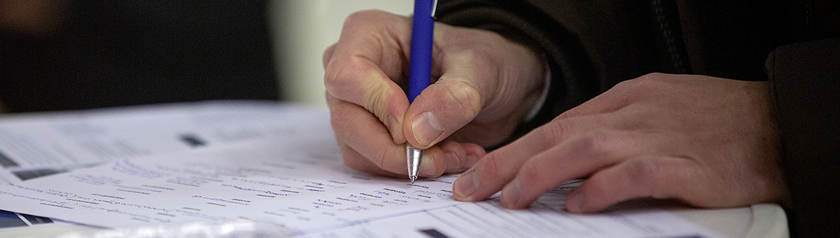 Last-minute registration at conference desk